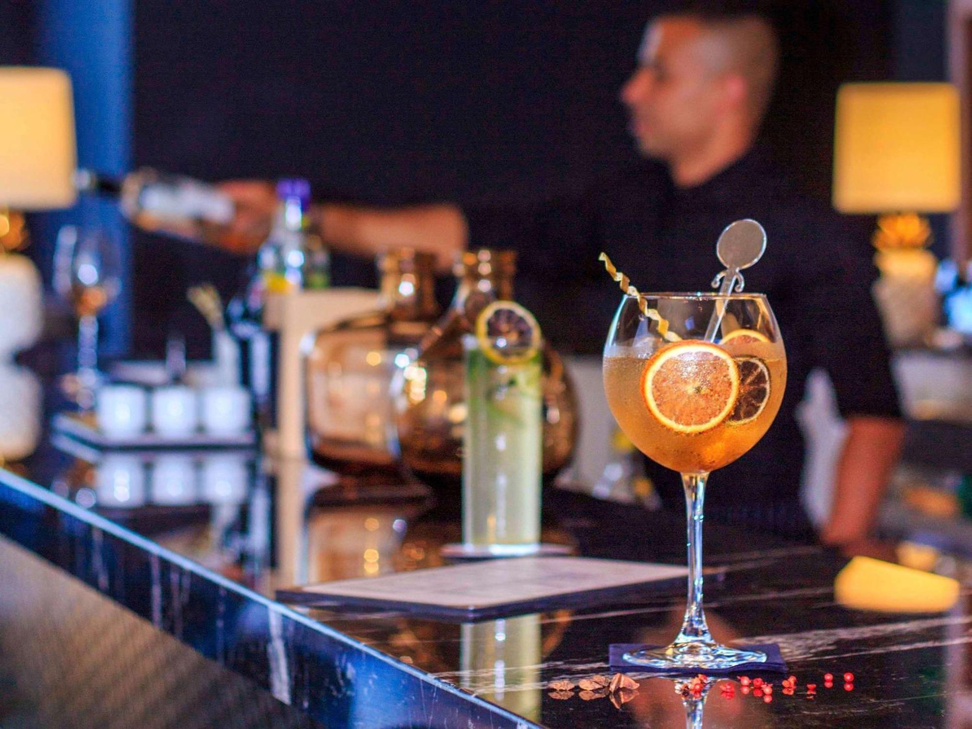 Novotel Medellin El Tesoro Экстерьер фото A bartender at work
